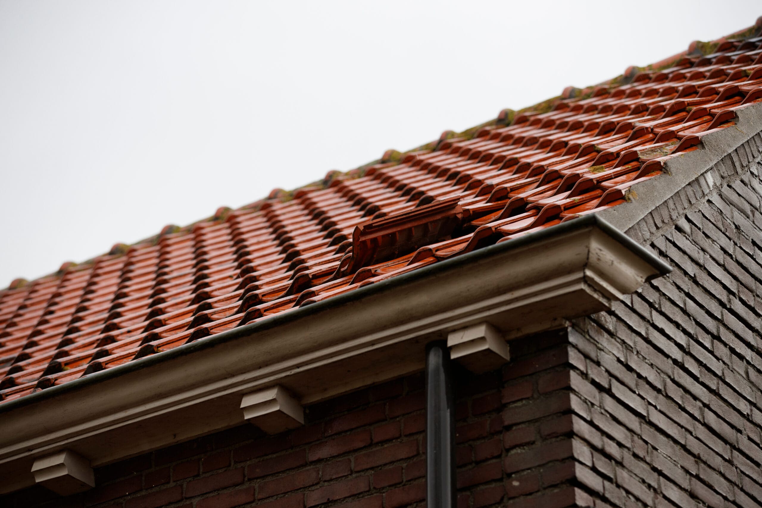 Careful repair work on a domestic tiled roof